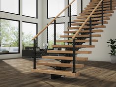 there is a stair case in the middle of a room with wood floors and windows