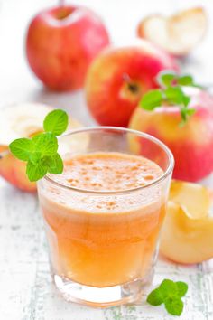 an apple cider is garnished with fresh mint