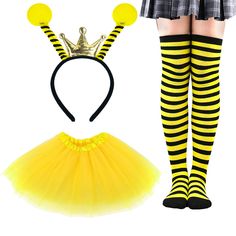 a woman wearing a yellow and black striped skirt with a crown on top of her head