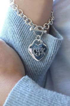 "Monogram Charm Bracelet with Heart and Toggle Closure This statement personalized bracelet is a must have for any fashionista. It is fun and preppy and will work well with your dressy or casual attire. Heart will be monogrammed. This bracelets comes gift boxed making it perfect for bridesmaids, birthdays, Valentines or any other occasion. Bracelet- 7\" How to Order: 1. Place item or items in cart. (If purchasing more than one item the shipping will automatically be combined. For 5 or more items Personalized Heart-shaped Charm Bracelet, Personalized Heart Bracelet For Best Friend Gift, Silver Personalized Heart Bracelet, Personalized Metal Heart Bracelet For Friendship, Personalized Adjustable Classic Heart Bracelet, Personalized Heart Pendant Bracelet In Silver, Personalized Silver Heart Pendant Bracelet, Trendy Personalized Silver Heart Bracelet, Classic Adjustable Personalized Heart Bracelet