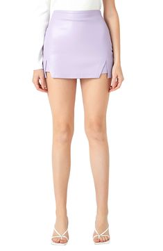 Flirty cutouts bring edgy style to these sleek faux-leather bottoms that look like a cute skirt with the comfort of shorts. Hidden side-zip closure Lined 100% polyester with polyurethane coating Hand wash, dry flat Imported Trendy Purple Mini Length Bottoms, Chic Faux Leather Shorts For Spring, Chic Purple Bottoms For Day Out, Trendy Leather Bottoms For Spring, Faux Leather Short Bottoms For Day Out, Spring Leather Short Bottoms, Faux Leather Shorts For Day Out, Leather Bottoms For Spring, Faux Leather Bottoms For Day Out In Spring