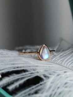 "Product description: Product Type - Ring Metal Type - 925 Solid Sterling Silver (High Quality Polishing & Finishing) Gemstone - Natural Moonstone Gemstone Size - 7x5 MM Gemstones Shape - Pear Cabochon Gemstone color - As Picture Gemstone Purity - 100% Natural (Guaranteed) Standard Shipping - 3 to 7 Days ($25 Extra) Economy Shipping - 10 to 20 Days (Free Worldwide) Please Note - Color in the picture may be slightly different from the actual product. Due to photographic light conditions. We t Luxury Si Clarity Moonstone Wedding Ring, Fine Jewelry Moonstone Teardrop Ring, Fine Jewelry Teardrop Moonstone Ring, Rose Gold Moonstone Ring As A Gift, Elegant Teardrop Moonstone Ring For Anniversary, Elegant Teardrop Moonstone Ring, Teardrop Stackable Jewelry For Anniversary, Delicate Teardrop Ring For Gifts, 14k Gold Moonstone Ring For Anniversary