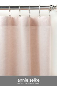 a curtain with the words annie selke written in white on it and pink curtains