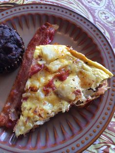 an omelet with bacon and a muffin on a plate