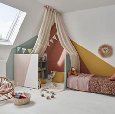 a child's bedroom decorated in pastel colors