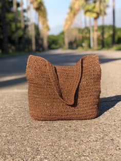 Any woman must have this bag for every fashionista.Whether you keeping it to yourself or gifting someone you care, it will be unforgettable. ✔️I made this beautiful bag from brown natural paper rope which is organic cotton. ✔️The interior of the straw summer bag has a magnetic button. Suitable for use as shoulder bag, beach bag or party bag ✔️You can combine your clothes with a straw summer bag on summer days ✔️Handcrrafted in Turkey ✔️Hand-crocheted with care ✔️This bag is light weight yet dura Eco-friendly Brown Shoulder Bag For Vacation, Trendy Woven Jute Shoulder Bag, Rectangular Hobo Bag For Daily Beach Use, Rectangular Hobo Bag For Daily Use And Beach Season, Trendy Bucket Jute Shoulder Bag, Trendy Jute Bucket Shoulder Bag, Trendy Natural Pouch Shoulder Bag, Brown Summer Travel Hobo Bag, Summer Style Brown Satchel Shoulder Bag