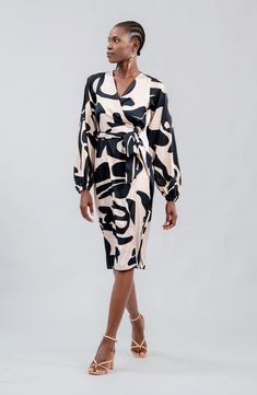 An allover print emboldens this sophisticated work-to-play midi designed in a wrapped silhouette. Each piece is designed for longevity. Every garment is made-to-order to reduce production waste. True wrap style with side tie closure Surplice V-neck Long sleeves Unlined 100% polyester Machine wash, tumble dry Made in Senegal Midi Wrap Dress, Long Sleeve Midi, Black Wrap Dress, Nordstrom Dresses, Wrap Style, Wrap Dress, Top Brands, Nordstrom, Luxury Fashion