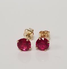 "Thanks for shopping our vintage estate store. We tend to sell well below wholesale and truly hope you enjoy all of our items. Many of the items are one of a kind, so please enjoy scrolling through the pictures and hopefully something will catch your eye. Brown spots are from camera or reflections. Nice estate 14k yellow gold created ruby or spinel studs. Color is red testing natural, but they are synthetic or created. Retails $189 on sale $59 Size: 3.5mm 1/8\" Weight: .54 gram Carat: .50ct per stud Nice studs, some that you will love, marked 14k and backs are included." Flower Birthday, Sparkly Ring, Pink Sapphire Ring, Earrings Flower, Brown Spots, Studs Earrings, Topaz Earrings, Birthday Flowers, Cz Diamond