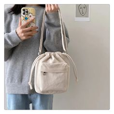 SPECIFICATIONSCN: ZhejiangBrand Name: PZKExterior: Solid BagModel Number: LE025Interior: Interior Zipper PocketShape: Casual ToteStyle: CasualPlace Of Origin: ZHE JIANG ProvincePlace Of Origin: ZHE JIANG ProvinceDecoration: noneOrigin: Mainland ChinaOccasion: VersatilePattern Type: SolidLining Material: POLYESTERMain Material: CorduroyClosure Type: stringCN: HebeiGender: WOMENHardness: SOFTsemi_Choice: yes Casual Hobo Tote Bag For Daily Use, Casual Hobo Tote Bag For Daily Life, Casual Canvas Satchel Bag For Daily Life, Casual Canvas Bag With Removable Pouch, Beige Bucket Canvas Bag For School, Casual Bucket Shoulder Bag For School, Casual Shoulder Bucket Bag For School, Casual White Bags For Daily Use, Casual Canvas Pouch Bag With Adjustable Strap