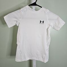 This Under Armour Boys' T-Shirt Is Perfect For Any Young Athlete. The Lightweight And Breathable Fabric Make It Suitable For All Seasons, While The Fitted Style Provides A Comfortable And Secure Fit. The Shirt Features A Classic Crew Neckline And Pullover Closure, With A White Color And Bold Logo Design That Makes It Perfect For Outdoor Sports. The T-Shirt Is Made From 90% Polyester And 10% Elastane, With Cotton Material That Provides A Comfortable Feel Against The Skin. The Shirt Is Suitable Fo Bold Logo Design, Hot Pink Shorts, Under Armour Girls, Bold Logo, Yellow T Shirt, Fitted Style, Under Armour Shirts, Loose Shirts, Hooded Tops