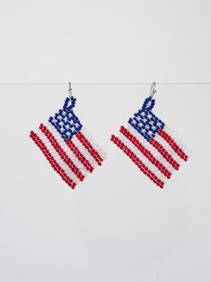 Enhance your patriotic style with our Rylee Patriotic USA Flag Beaded Dangle Earrings. These expertly crafted earrings feature a bold and beautiful USA flag design, perfect for showing off your love for your country. Made with quality materials, these earrings are sure to make a statement at any occasion. SizeHEIGHT:2.25" WIDTH: 1" QualityCrafted from premium materials for quality and endurance. ImportedE8289SMT Patriotic Earrings For 4th Of July, Patriotic 4th Of July Earrings, Patriotic Dangle Earrings For Independence Day, Patriotic Drop Earrings For 4th Of July, Patriotic Dangle Jewelry For Independence Day, Patriotic American Flag Jewelry For 4th Of July, Red Patriotic Beaded Earrings, Patriotic Beaded Earrings For 4th Of July, Patriotic Multicolor Dangle Jewelry