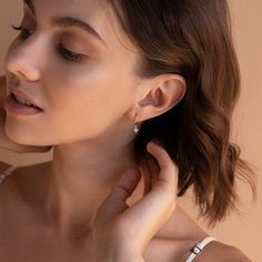 When you need something to boost your mood, why not add a bit of sparkle? Our Diamond Flower Drop Earrings are dainty and minimalist to allow for that subtle yet glowing look. Styled with a flowy and lightweight outfit, you will never want to take them off. Material: High Quality Solid 925 Sterling Silver Finish: Sterling Silver ∙ 18K Gold Hoop Dimensions: ~8.5mm Inner Diameter | ~11mm Outer Diameter Featuring Huggie Hoops with a dangling ~5.5mm CZ Diamond Floral Charm Sold as a Pair Part of our Amazon Jewelry, Diamond Huggies, Flower Drop Earrings, Art Deco Diamond Rings, Boost Your Mood, Earring Trends, Free Earrings, Diamond Charm, Station Necklace