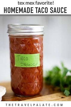 an easy homemade taco sauce recipe in a mason jar with a note pinned to it