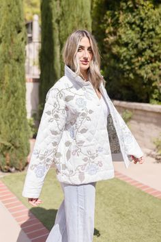 The stunning Hailey Shacket features a beautiful floral embroidered design on a crisp white background, making it a must-have this season. With its long sleeves, button down front, and large side pockets, this shacket not only adds style but also practicality to any outfit. Details + Fit 100% Polyester Runs True to Size Hand Wash Cold Hang Dry Collared Neckline Long Sleeves Button Down Front Large Side Pockets Quilted Floral Embroidered Design White | Multi | Printed Model is 5'6" and wearing a size Small