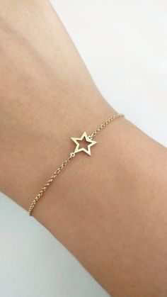 14K 9K Solid Gold Star Bracelet, Open Star Bracelet, Solid Gold Star Frame Bracelet, Dainty Star Charm Bracelet, Celestial Jewelry, Gift for Her, Gift for Daughter, Girlfriend Gift, FREE EXPRESS SHIPPING Beautiful and delicate bracelet with a small star frame charm made in 14K or 9K solid gold. Whisper...Reach for the Stars! Crescent Moon Bracelet: https://www.etsy.com/listing/747232649 Heart Bracelet: https://www.etsy.com/listing/737486490 -------------------------------------------------- D E Dainty Yellow Gold Star Bracelet, 14k Gold Star Charm Bracelet, 14k Gold Bracelet With Star Charm, 14k Gold Bracelets With Star Charm, Gold Star Charm Chain Bracelet, Gold Chain Bracelet With Star Charm, 14k Gold Star-shaped Bracelet Gift, 14k Gold Star Bracelet Gift, Gold Star-shaped Bracelet As Gift