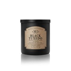 a black candle with the words mii last call on it's label in front of a white background