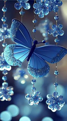 a blue butterfly hanging from a chandelier