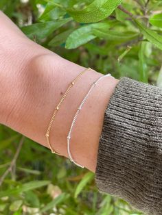 This listing is for ONE beautiful dainty gold filled or sterling silver satellite bracelet.   - Looks so pretty stacked or worn on its own and makes a perfect gift for your loved ones! If unsure of sizing, measure wrist with tape measure and add on 1/2 inch.  It will be a loose fit but will be easier to clasp on.  If you want a snug fit, you can add on 1/4 inch but it will be a little more difficult to clasp. You can also wrap your wrist with a string and measure string against a ruler.   Please Adjustable Gold Bracelet With Satellite Chain, Adjustable Delicate Chain Charm Bracelet, Dainty Beaded Bracelets With Satellite Chain, Dainty Beaded Bracelet With Satellite Chain, Adjustable Minimalist Gold Bracelet With Satellite Chain, Delicate Sterling Silver Bracelet With Adjustable Chain, Dainty Adjustable Gold Bracelet With Satellite Chain, Adjustable Delicate Sterling Silver Bracelet As A Gift, Sterling Silver Adjustable Delicate Chain Bracelet