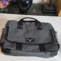 Black And Gray Messenger Bag, Missing Shoulder Strap, By Vangoddy, Front Pocket With Snap Closure, 2 Main Zippered Pockets, One Pocket Has Divider In It. New Without Tags. 19" X 15" X 3" Gray Canvas Shoulder Bag For School, Gray Shoulder Bag For School, Gray Rectangular Bag With Zipper Closure, Gray Rectangular Shoulder Bag With Zipper Closure, Gray Rectangular Shoulder Bag With Zipper, Gray Shoulder Bag With Zipper For School, Casual Black Laptop Bag With Luggage Sleeve, Gray Zipper Closure Shoulder Bag For School, Gray School Bag With Adjustable Strap