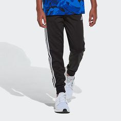 Simple and sporty. That's the vibe of these boys' joggers. Every detail is classic adidas from the 3-Stripes to the signature sheen of tricot. Need we say more? Don't worry about dirt. They're totally washable. Front Style: Flat FrontFeatures: CuffedClosure Type: DrawstringFit: Regular FitPockets: 2 Side Slip PocketsRise: Mid RiseFiber Content: 100% PolyesterFabric Description: KnitLeg Style: Cuffed LegCare: Machine Wash, Tumble DryCountry of Origin: Imported Adidas Sweatpants With Elastic Waistband For Sports, Adidas Moisture-wicking Sweatpants For Jogging, Adidas Sporty Joggers With Elastic Waistband, Adidas Sweatpants With Side Stripes For Jogging, Sporty Adidas Sweatpants With Elastic Waistband, Adidas Sporty Activewear With Elastic Waistband, Sporty Adidas Activewear With Elastic Waistband, Sporty Joggers With Side Stripes For Jogging, Adidas Sweatpants With Side Stripes For Sports