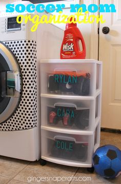 a dryer sitting next to a washing machine with the words soccer mom organization written on it