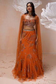 Burnt orange net mermaid lehenga with an attached cancan and floral motifs, sequins and zari hand embroidery. Comes with a padded blouse and dupatta. - Aza Fashions Lahenga Design Latest Party Wear, Orange Anarkali Organza Sets, Bollywood Style Orange Organza Choli, Orange Anarkali Lehenga In Organza, Anarkali Orange Organza Lehenga, Festive Orange Organza Choli, Orange Organza Lehenga For Wedding, Festive Orange Organza Lehenga, Orange Embellished Party Sets