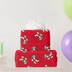 two wrapped presents sitting on top of a table