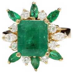 5.05 Carats Natural Emerald and Diamond 14K Solid Yellow Gold Ring Total Natural Green Emerald Weight is: Approx. 3.95 Carats (transparent) Emerald Measures: Approx. 9.23 x 7.70mm Emerald Treatment: Oiling Natural Round & Marquise Diamonds Weight: Approx. 1.10 Carats (color G-H / Clarity SI1-SI2) Ring size: 7 (we offer free re-sizing upon request) Ring total weight: Approx. 5.9 grams SKU #TF122 Green Emerald Ring, Emerald And Diamond Ring, Vintage Cocktail Ring, Yellow Gold Diamond Ring, Gold Cocktail Ring, Gold Cocktail, Diamond Cocktail Rings, Vintage Cocktail, Marquise Diamond