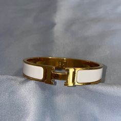 Hermes Clic H, Clic Clac White Bangle Bracelet- White And Gold Authentic, Purchased From Poshmark And Had It Authenticated Via Poshmark. Posh Will Authentic Above $500 Gm Size, Larger Has Scratches From Normal Wear But Enamel Is All Intact, No Cracks. Some Scratches And Dings But Nothing Significant. Please, No Lowballs. As Pictured Selling Or Trading For Similar In Pm Size. Hermes Jewelry, Christmas List, Bangle Bracelet, Womens Jewelry Bracelets, Bangle Bracelets, Bangles, Women Jewelry, Bracelet, Christmas