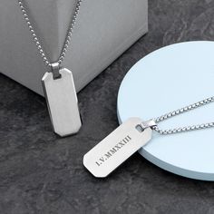 If you’re looking for a stylish and unique gift for that special guy in your life, look no further than our beautiful Personalised Men's Brushed Steel Dog Tag Necklace! Perfect gift for birthdays, Father’s Day or Christmas (or just about any special occasion you can think of!) - that dapper man in your life is sure to cherish such a thoughtful and stylish gift. Whether he wears it everyday or saves it for special occasions, this gorgeous necklace is sure to impress.Personalise his brushed steel necklace with his name so everyone knows whose it is. And our personalisation team will do the rest, engraving it onto the pendant, and creating a beautiful gift that will add some extra pizazz to any outfit. He'll love showing off his new necklace to friends and family alike and they’re sure to be Dapper Man, Mens Jewelry Necklace, Father's Day Gifts, How To Show Love, Brushed Steel, Stylish Gifts, Dog Tag, Stainless Steel Necklace, Gorgeous Necklaces