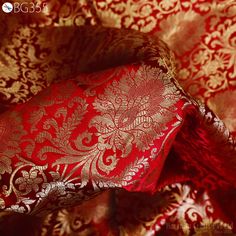 Brocade Fabric Banarasi Brocade Fabric by the Yard Banarasi Brocade Red Gold Weaving for Wedding Dress Home Decor Indian Art Blended Silk. This is a beautiful heavy benarse blended silk brocade floral design fabric in Red and Gold. The fabric illustrate golden woven beautiful design on Red background. ➤Fabric Type: Blended Silk (Viscose and Silk) Fine quality Zari Brocade Weaving from Banarasi. ➤ Code: bg355 ➤ Color: Red and Gold. ➤ Listing: By 1 Yard of fabric.  ➤ Width of the fabric is 44 inches. ➤ Care: Dry Clean Only Fabric Type: Blended Silk (Viscose and Silk) Super Fine Quality Brocade Weaving from Banarasi, which is known as "Kimkhab". During the Mughal period (1556-1707), when kimkhwāb was extremely popular with the rich, the great centres of brocade weaving were Benares (Vārānasi) Elegant Red Brocade Traditional Wear, Red Brocade Traditional Wear With Dupatta, Elegant Red Traditional Wear With Motifs, Elegant Red Jamawar Lehenga, Red Brocade Dupatta With Traditional Drape, Elegant Red Jamawar Traditional Wear, Red Traditional Wear With Motifs For Wedding, Traditional Red Brocade Lehenga, Elegant Red Dupatta With Motifs