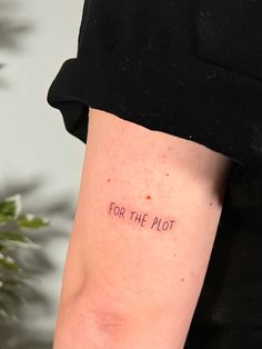 a woman's arm with the words for the plot written on her left side