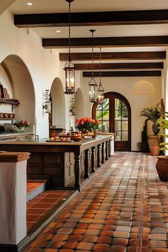 a kitchen with an island and tiled floor