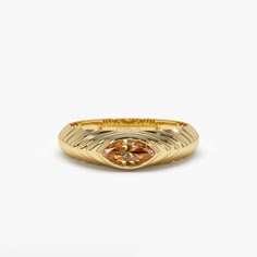 This 14k Gold step beveled ring features a radiant 7x3.5 MM marquise cut Citrine, the birthstone for November. The ring has a modern design, perfect for everyday wear, and the Citrine gemstone adds a pop of color to the piece. The step beveled design adds depth to the ring and the 14k Gold gives it a touch of luxury. This ring is perfect for anyone born in November or anyone who loves the color yellow. Features: * Made to Order * Gold Kt: 14K Solid Gold (also available in 18K) * Available Gold Colors: Rose Gold, Yellow Gold, White Gold * Marquise Citrine: 1 pc 7 x 3.5 MM * Citrine Carat Weight: 0.35 ctw * Ready to Ship in 7-10 Business days  ▶ See more of our Gemstone Jewelry here- https://etsy.me/3CGRdMI ▶ See our storefront here - http://etsy.me/2lUcVnH  ▶ All store sections here * Diamo Luxury Faceted Yellow Gold Rings, November Birth Stone Rings, Luxury Gold Marquise Signet Ring, Gold Marquise Topaz Promise Ring, Gold Marquise Ring With Bezel Setting, Marquise Polished Promise Ring, Gold Marquise Birthstone Ring, Gold Marquise Birthstone Ring With Gemstone, Beveled Ring