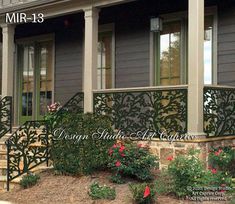 the front porch and steps of a house with wrought iron railings on each side