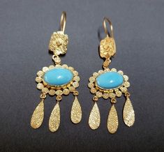 -product type - gold vermeil turquoise earring -material - silver -purity - 925 - details of 1 pair -stone - turquoise -turquoise weight - 8.35 carat -total weight - approx - 8.920 grams -silver weight - 925 - approx - 7.250 grams -turquoise size - 9 x 13 mm Turquoise Hallmarked Earrings For Gift, Elegant Turquoise Gold-plated Earrings, Turquoise Gold-plated Earrings For Gifts, Turquoise Filigree Earrings As Gift, Turquoise Filigree Earrings For Gift, Turquoise Earring, Vintage Earring, Arizona Turquoise, Earring Gift