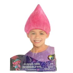 a young boy wearing a pink trolly hat and purple shirt with the word, purple / pink reversible wig