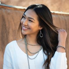 Our Desert Pearls are an homage to the sterling silver Navajo beads found throughout classic Southwestern jewelry. Whereas the traditional Navajo beads are handmade by Navajo artists, the silver pearls in our Desert Blossom collection are handcrafted and strung by our local Navajo and Non Navajo jewelers in house. Choose between high polish and rustic patina, or mix and match to bring together the old and the new. Sterling Silver Earrings 2" long 5mm and 7mm beads Handcrafted in New Mexico, USA Flower Earrings Silver, Silver Bead Earrings, New Mexico Usa, Southwestern Design, Loop Earrings, Southwestern Jewelry, Cactus Flower, Silver Bead, Silver Pearls