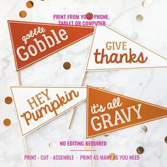 three red and orange flags that say gobble, hey pumpkin, give it all gravy