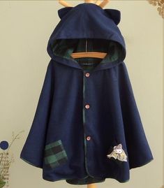 Material : CottonColor : Navy blue, GreySize : Free size.Shoulder : 44cm, Bust : 124cm, Sleeve length : 43cm, Cloth length : 59cm. Fall Cotton Cape Outerwear, Cute Cotton Outerwear For Fall, Cute Fall Outerwear With Buttons, Blue Hooded Winter Cape, Winter Long Sleeve Button Cape, Winter Long Sleeve Cape With Buttons, Cute Winter Outerwear With Buttons, Cute Cotton Outerwear With Buttons, Blue Cape Outerwear For Spring