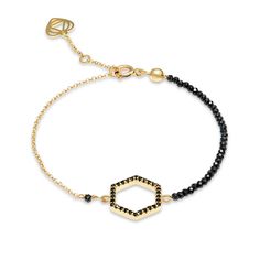 A unique hexagon hand crafted bracelet. Features a cubic zirconia hexagon charm that is linked with tiny sparkly spinel 2mm faceted gems on one side and with a gold chain on the other.  Set in 18k gold plated sterling silver.   Wear it on its own for a unique signature look or stack this piece with other bracelets. Measures 18cm in total including 2cm extendable chain. Though I would be happy to craft a slightly smaller or larger size bracelet to fit your wrist perfectly. Details: 18k gold plated sterling silver sparkly black spinel 2mm hexagon charm embellished with black zirconia open ring clasp 5,5mm  24/7 bracelet water friendly    super resistant made with professional beading jewelry wire one year warranty Elegant Hexagon Jewelry For Everyday, Elegant Everyday Hexagon Jewelry, Hexagon Bracelet, Unique Signature, Faceted Gems, Handcrafted Bracelets, Black Spinel, Signature Look, Open Ring