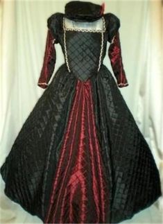 This listing is for a one piece Renaissance, Elizabethan, Wedding, Romeo & Juliet or Tudor dress/gown, your custom size choice of busts 32" - 46". The entire dress, with the exception of the front skirt inset and lower straight sleeves, is made of black pintuck taffeta. And the remainder of the dress is made of burgundy pintuck taffeta. It has small puffy upper sleeves that are stuffed with lightweight fiberfill (or can be left unstuffed) and a lower straight sleeve that conforms to the elbow. T Gothic Fitted Gown For Fancy Dress, Fitted Gothic Gown For Fancy Dress, Fitted Black Ball Gown For Costume Party, Elegant Black Costume Gown, Elegant Black Gown For Costume, Elegant Black Gown For Fancy Dress, Fitted Gothic Ball Gown, Fitted Historical Design Floor-length Ball Gown, Fitted Floor-length Ball Gown With Historical Design