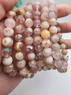 "All bracelets measure wrist size of 7.5\". All beads measure 8mm and are all natural Flower Agate with strong pink tones, also called Cherry Blossom Agate." Cherry Blossom Agate, Cherry Blossom Flower, Coral Bracelet, Cherry Blossom Flowers, Flower Agate, Quartz Sphere, Small Rose, Gifts Birthday, Pink Tone