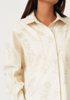 An embroidered cotton shirt jacket with a snap button front. Embroidered Relaxed fit Long sleeves Button wrist closure Collared neckline Snap button front Front patch pockets Lightweight shirt jacket Delicate embroidered floral details add a bohemian touch to this cool, lightweight spring shirt jacket. With long sleeves, a classic collared neckline, and a snap button front. The perfectly relaxed fit layers well over a simple tee or a light sweater. Model is 5'9, wearing a size S.Style: I-20289W- Cotton Button-up Blouse With Floral Embroidery, Casual Long Sleeve Shirt With Floral Embroidery, Cotton Long Sleeve Blouse With Floral Embroidery, Long Sleeve Cotton Shacket With Buttons, Floral Embroidered Shirt For Workwear In Fall, Fall Embroidered Tops For Work, Casual Floral Embroidery Tops With Spread Collar, Cotton Long Sleeve Shacket With Buttons, Fall Workwear Tops With Embroidery