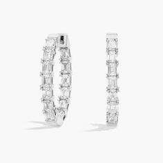 An elevated twist on a timeless piece, these 14k white gold diamond hoop earrings showcase 3 ct. tw. of emerald diamonds intricately arranged in an eternity-inspired design. Wedding Ring Guide, Gold Diamond Hoop Earrings, Platinum Rose Gold, Engagement Rings Marquise, Gold Rings Fashion, Emerald Cut Diamond, Gold Pearl Necklace, Ladies Diamond Rings, Diamond Hoop Earrings