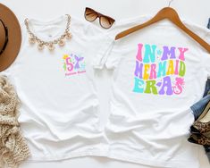 🌊 Dive into Fantasy with Our Custom "In My Mermaid Era" Shirt! ️ ✨ Make waves with a personalized touch! Our "In My Mermaid Era" shirt invites your little one to explore the depths of imagination in style. Featuring a charming mermaid design and custom text, this shirt is perfect for celebrating their unique mermaid-loving spirit. 🎁 Looking for a magical birthday gift for your little mermaid enthusiast? Look no further! Our custom shirt is a delightful and unforgettable present that's sure to Birthday Mermaid Shirt, Birthday Mermaid, Magical Birthday, Mermaid Design, Mermaid Shirt, Mermaid Dreams, Retro Kids, Make Waves, Mermaid Birthday