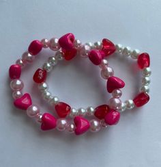 Pearl and Heart Bracelet Valentine's Day Pearl Bracelet With Heart Charm, Valentine's Day Heart Charm Pearl Bracelet, Valentine's Day Heart Pearl Bracelet, Pink Heart Beads Bracelets For Valentine's Day, Valentine's Day Pink Bracelets With Heart Beads, Pink Heart-shaped Beaded Bracelets For Valentine's Day, Pink Heart-shaped Bracelets With Colorful Beads, Pink Heart-shaped Bracelet With Colorful Beads, Heart-shaped Beaded Pearl Bracelet Gift