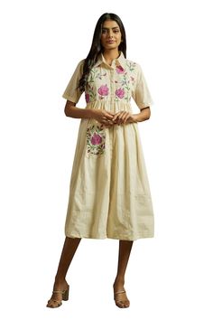 Off white dress embroidered with multicolored kashmiri aari on front yoke, embroidered pocket on one side and gathered waist embroidered. - Aza Fashions Straight Kurta With Multicolor Intricate Embroidery, Folk Cotton Dress With Resham Embroidery, Festive Cotton Dress With Floral Embroidery, Beige Embroidered Dress With Short Sleeves, Cream Short Sleeve Dress With Floral Embroidery, Traditional Off White Dress With Floral Embroidery, Embroidered Straight Kurta Dress In Cream, Cotton Dress With Intricate Embroidery In Straight Kurta Style, Cotton Straight Kurta With Intricate Embroidery