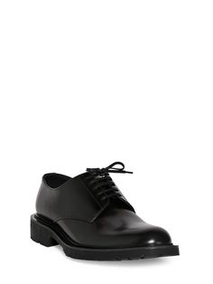 Leather upper. Front lace-up closure. Logo detail. Rubber sole Leather Lace-up Derby Shoes, Goodyear Welted Calf Leather Lace-up Shoes, Designer Calf Leather Lace-up Derby Shoes, Luxury Lace-up Oxfords For Work, Leather Wingtip Lace-up Shoes With Lug Sole, Modern Lace-up Leather Shoes For Derby, Designer Lace-up Oxfords With Brogue Detailing, Luxury Leather Sole Lace-up Derby, Calf Leather Lace-up Dress Shoes For Semi-formal