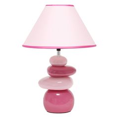 a pink lamp sitting on top of a table